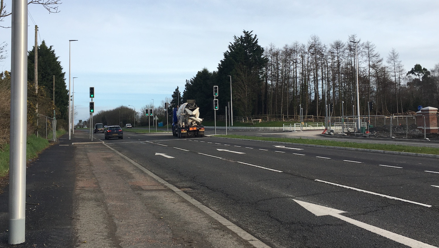 View towards a T-junction on a
                          dual-carriageway with new traffic signals.