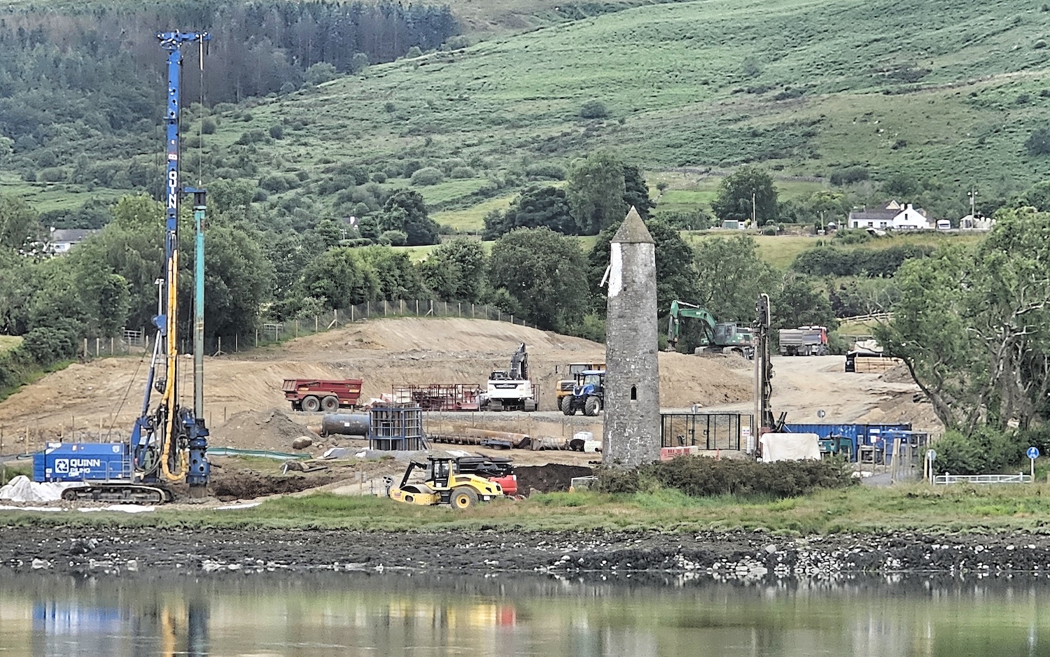 View across the river with a pile driver
                          on the left, the existing navigation tower on
                          the right and a lot of dug over earth in the
                          centre.